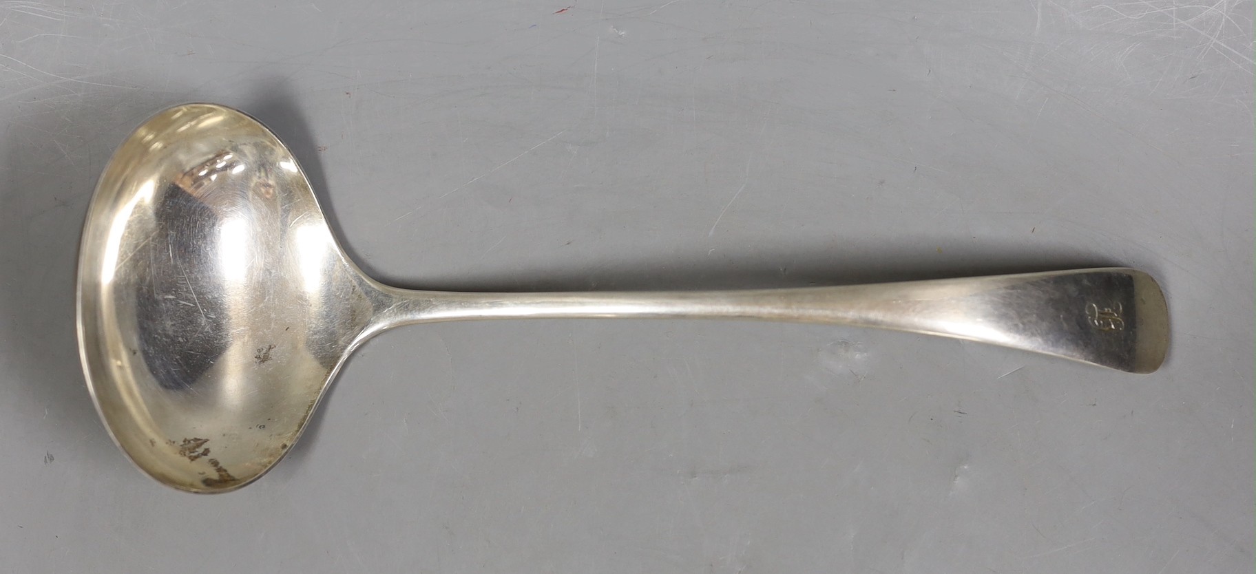 A George V silver Old English pattern soup ladle, William Hutton & Sons, Sheffield, 1927, engraved with names, 28.5cm, 8.1oz.